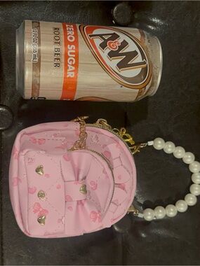 Under One Sky Pink Mini Quilted Bow Wristlet Clutch with Pearl Handle